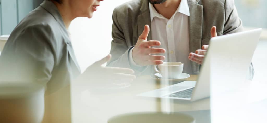 Two recruiters around a computer