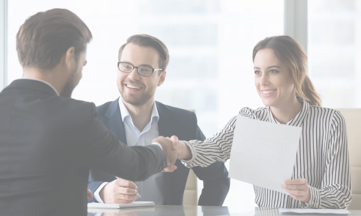Handshake between manager and a new hire thanks to Talance Group