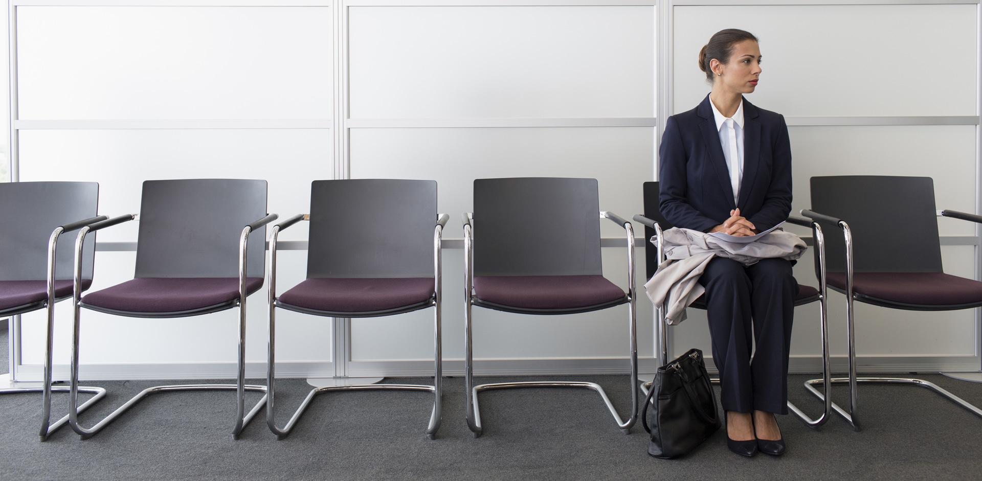 A job candidate sits in a waiting room as she was instructed by Talance Group recruiters to arrive early to her interview.